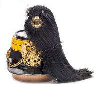 †An Austrian M1870 Artillery NCO’s shako, black cloth body with Patent leather peak, headband and