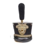 †A United States West Point Cadet shako, c 1930, black beaver body, patent leather top, headband and