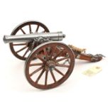 †A wood and alloy model of a French Waterloo period field gun, barrel 7¾”, overall 14”. GC