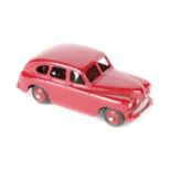 A rare Dinky Toys Standard Vanguard 40e. An example in maroon with open rear wheel arches, (normally