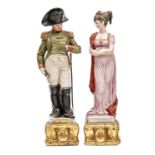 2 painted porcelain figures, Napoleon and Josephine, he in full dress uniform with bicorne hat,