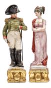 2 painted porcelain figures, Napoleon and Josephine, he in full dress uniform with bicorne hat,