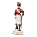 A similar small scale figure “Royal Artillery 1820”, officer in full dress, hand resting on drawn