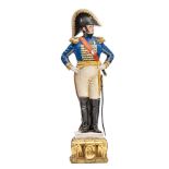 A painted porcelain figure of a Napoleonic naval officer, in full dress with bicorne hat, sword