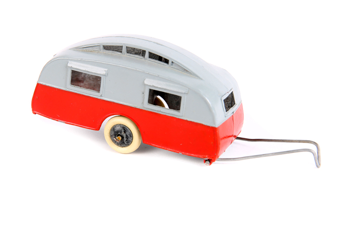 A rare Dinky Toys Caravan 30g. An example in grey and red with black smooth wheels and white