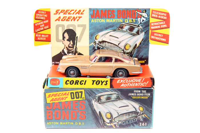 Corgi Toys James Bond’s Aston Martin D.B.5 261. 1st type in metallic gold with red interior. Boxed