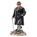 A Royal Doulton painted porcelain figure of Winston Churchill, inspecting bomb damage, in hat and