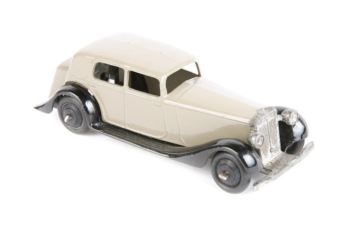 Dinky Toys Daimler 30c. In fawn with black closed chassis, ridged black wheels and black tyres.