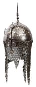 An 18th century Indian silver damascened khula khud, the skull covered overall with a pattern of