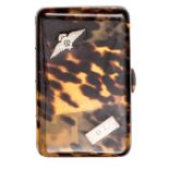A WWII period tortoiseshell cigarette case, the lid inlaid with small silver (not HM) RAF wings