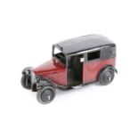 Dinky Toys TAXI 36g. An example in maroon and black with open rear window and ridged wheels with