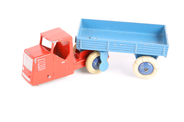 A Dinky Toys Railway Mechanical Horse and open wagon 33w An example with red cab and mid blue open