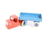A Dinky Toys Railway Mechanical Horse and open wagon 33w An example with red cab and mid blue open
