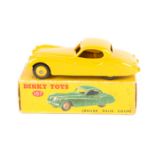 Dinky Toys Jaguar XK120 Coupe 157. An example in yellow with light yellow wheels and black tyres.