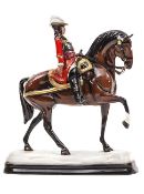 A small scale “Michael Sutty Porcelain Manufactory” figure “The Queen Consort’s Regiment of Dragoons