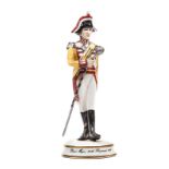 A similar small scale figure of a “Drum Major 34th Regiment 1811”, in full dress “carrying