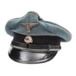 A scarce Third Reich SS man’s peaked service cap, of black felt with leather strap, plain black