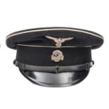 A Third Reich Waffen SS visor cap, blue/grey with white piping, black band, fibre peak, leather