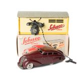 A 1950’s Schuco Garage 1500. A tinplate single car garage with telephone mounted to one side with