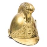 A French fireman’s brass helmet c 1900, brass binding to front and back peaks, studs at back, ear to