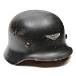 A German M40 style steel helmet, the skull with smooth black finish, 3 large domed rivet heads and