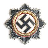 A Third Reich German Cross in gold, with 4 small domed rivets, the pin stamped with number 1. GC (
