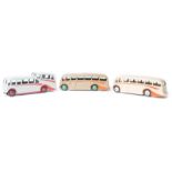 3 Dinky Toys. 2 x Luxury coach (281). One with cream body and wheels and orange flashes, one in fawn