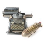 2 German tinplate toys. A 1920’s child’s typewriter by GSN (Gebruder Schmidt Nurnberg). A Junior