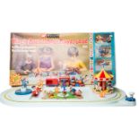 A Corgi Toys Magic Roundabout set (853). Light blue base with railway track around perimeter,