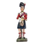 A continental painted porcelain figure of an officer “93rd Highlanders, 1815”, in full dress,