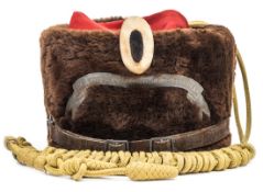 An Imperial German other ranks Hussar busby (Pelzmutze), of brown fur with scarlet bag, yellow cap