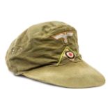 A German Afrikakorps ski cap, green piping on front, red cotton lining with maker’s name stamp and