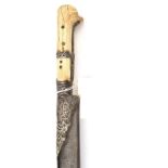 A Turkish yataghan, blade 25½” with worn decoration and traces of an inscription, the blade mounts