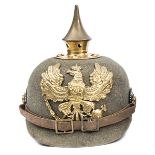 A Prussian enlisted man’s grey felt “ersatz” pickelhaube, with reinforced turned over rim, brass