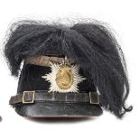 A Saxony Jager NCO’s felt shako, with bi-metal plate, silver lace around the top of the skull, black