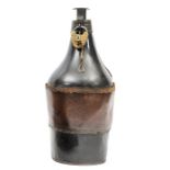 A large flask shaped black leather powder magazine c 1860, height 14½”, the brass baluster top