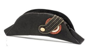 An Imperial German officer’s bicorn hat, black beaver body, triple corded lace loop on red/white/red