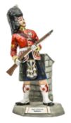 A large Michael Sutty painted porcelain figure of a Sergeant “Argyll & Sutherland Highlanders”, in