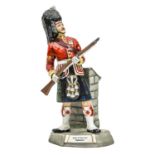 A large Michael Sutty painted porcelain figure of a Sergeant “Argyll & Sutherland Highlanders”, in