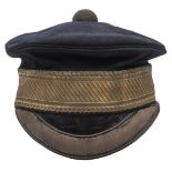 An officer’s blue cloth peaked forage cap, gilt lace headband, bullion edging to black patent