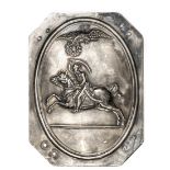 A small continental die struck silver plated panel, of rectangular form with cut off corners,