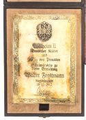 A fine Imperial German presentation brass plaque, applied Prussian eagle, inscribed “Wilhelm II