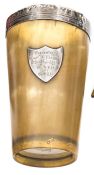 A hallmarked silver rimmed horn beaker bearing a presentation inscription to Captain William