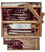 A very good WWI army surgeon’s field service case of instruments, the crimson velvet lined case with