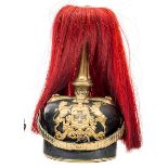 A Wurttemburg Reserve Dragoon officer’s pickelhaube, with gilt mounts, the plate with reservist’s