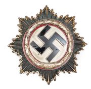 A good Third Reich German Cross in silver, the reverse with 6 domed rivets and no maker’s mark,