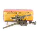 Britains 155mm. Gun No.2064. Complete with barrel travelling clamp, trail wheels, spades, 4 shells