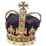 A replica state crown, of brass set with glass “jewels”, purple velvet inner with white fur
