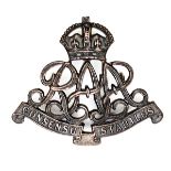 An officer’s bronze cap badge of the R Australian Artillery, crowned monogram and title scroll. (