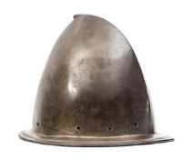 A cabasset, c 1600, formed in one piece, the narrow brim with turned over edge, the crown with